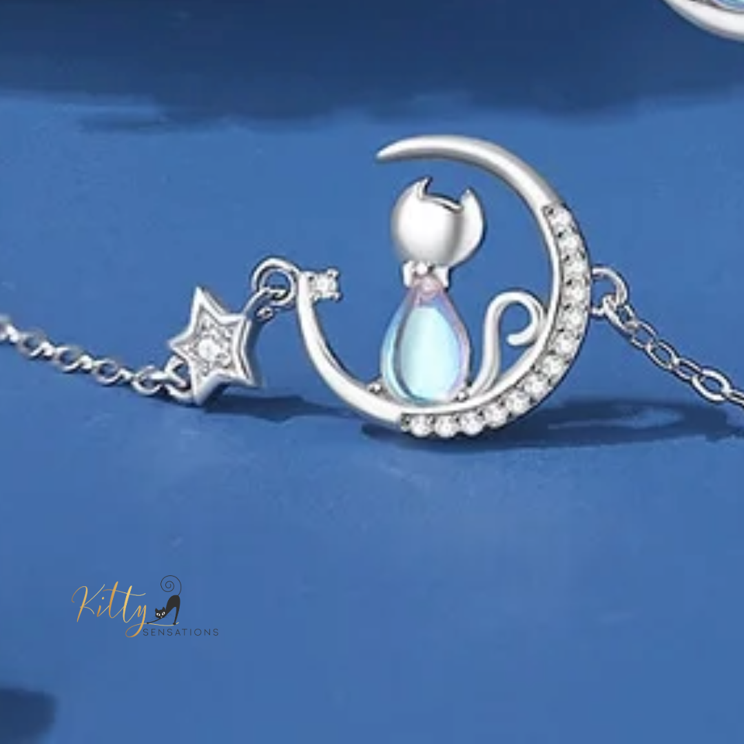 Blue Crystal Moon Kitty Bracelet in Solid 925 Sterling Silver (Adjustable Length) ($80.77): https://www.kittysensations.com/products/blue-crystal-moon-kitty-bracelet-in-solid-925-sterling-silver-adjustable-length